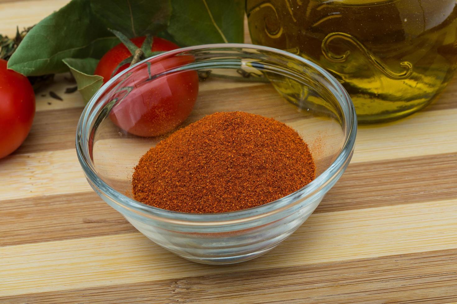 Paprika powder on wooden board photo