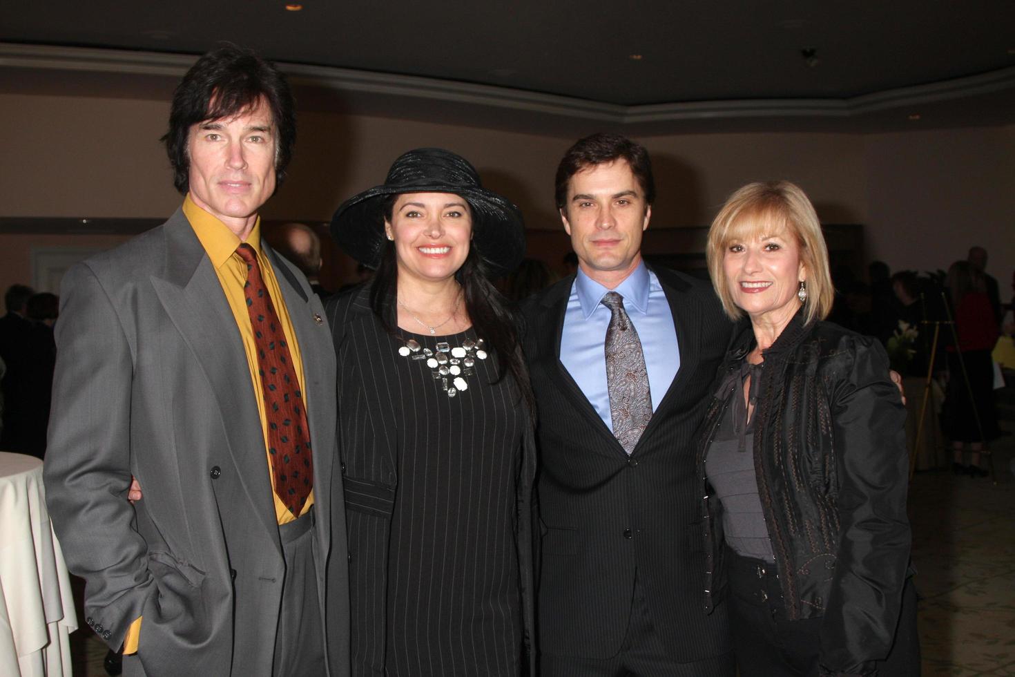 LOS ANGELES, FEB 20 - Ronn Moss, Devin DeVasquez Moss, Rick Hearst and mom arrives at the 2011 Catholics in Media Associates Award Brunch at Beverly HIlls Hotel on February 20, 2011 in Beverly Hills, CA photo