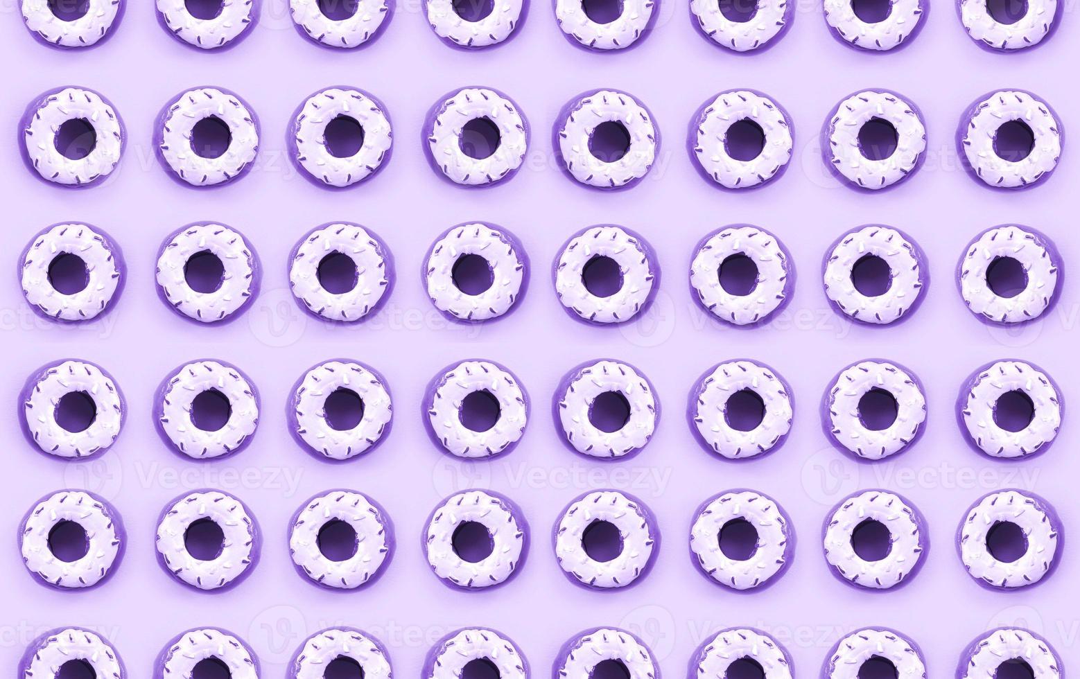 Many small plastic donuts lies on a pastel colorful background. Flat lay minimal pattern. Top view photo