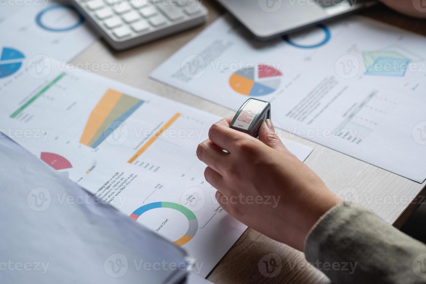 Marketing, Financial, Accounting, Planning, Businesswoman stamping approval on documents at office. photo