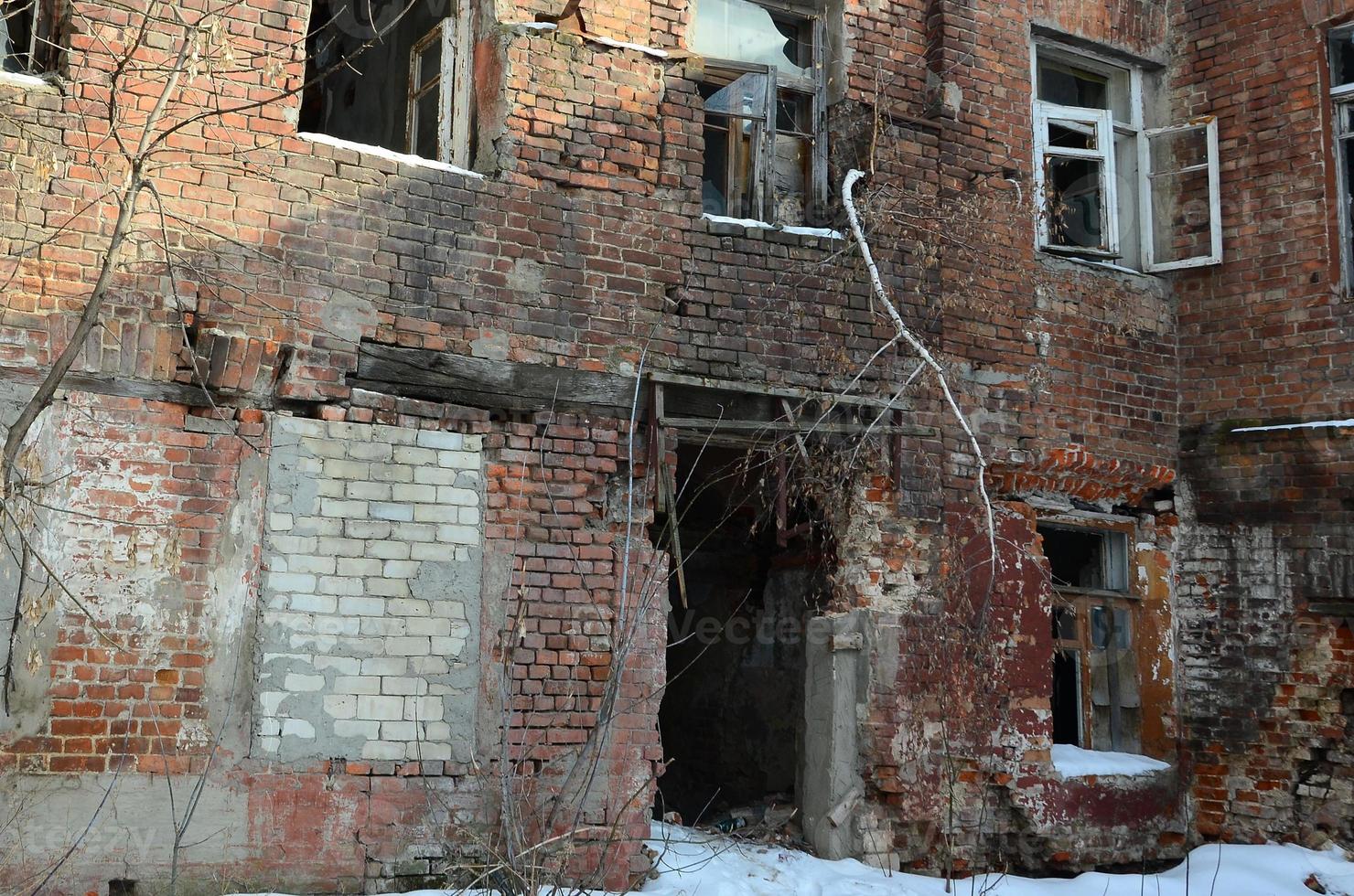 Fragment of an abandoned two-story building after military operations in Donetsk photo