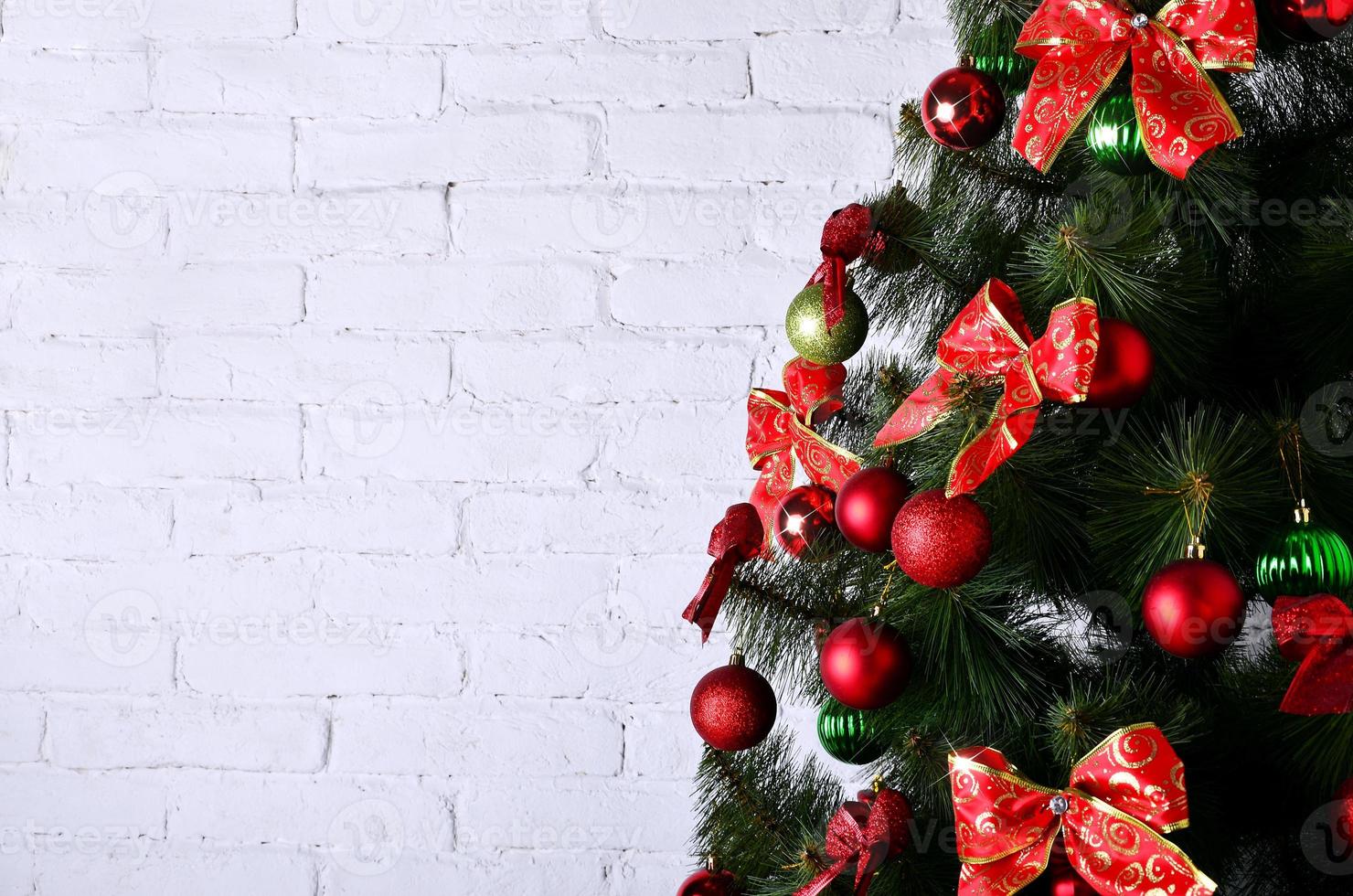 Detailed photo of the Christmas tree on white brick wall