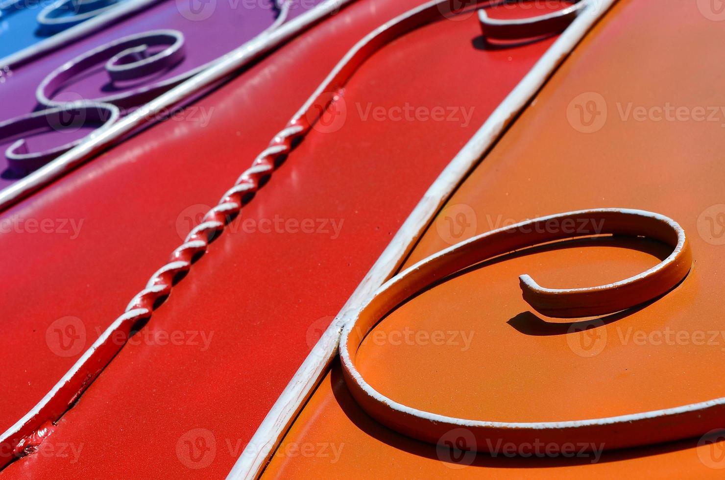 Metal texture of a piece of colored wall with a forged pattern photo