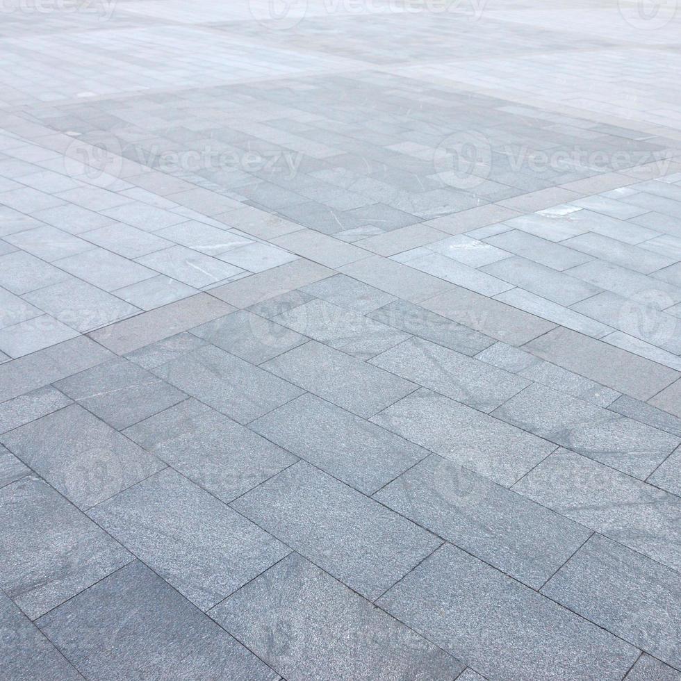 Fragment of the square paved of a large granite tiles photo