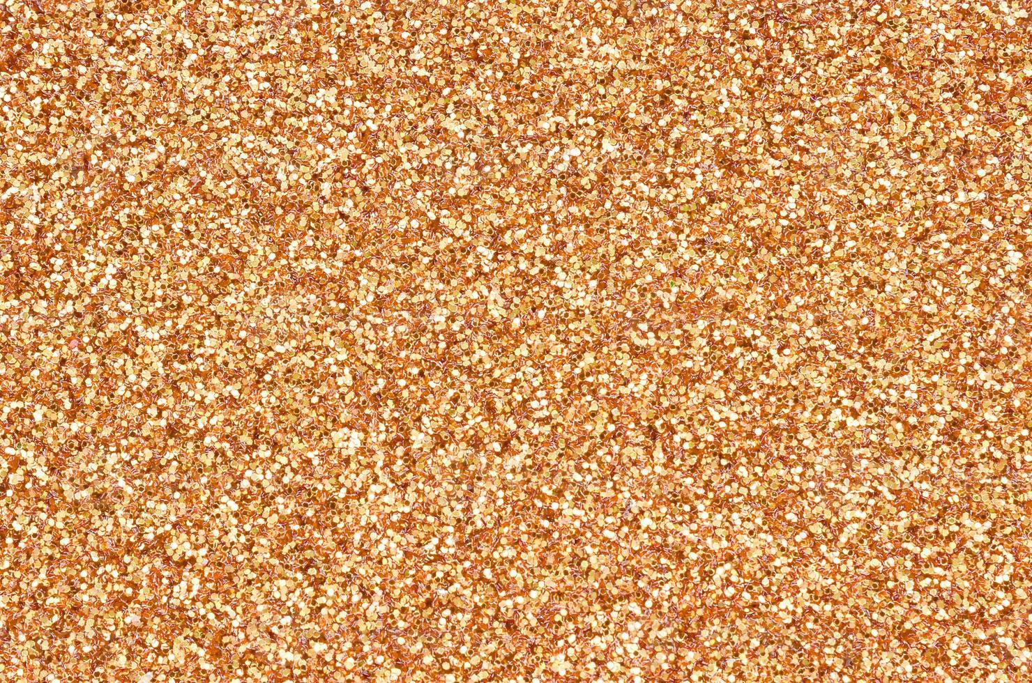 Orange decorative sequins. Background image with shiny bokeh lights
