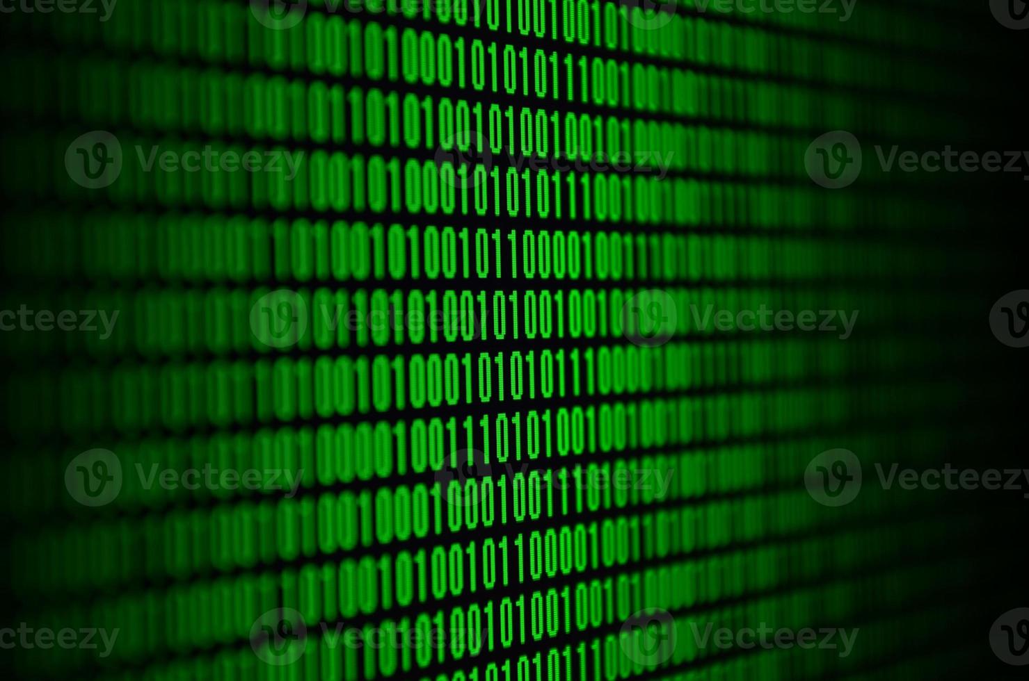An image of a binary code made up of a set of green digits on a black background photo