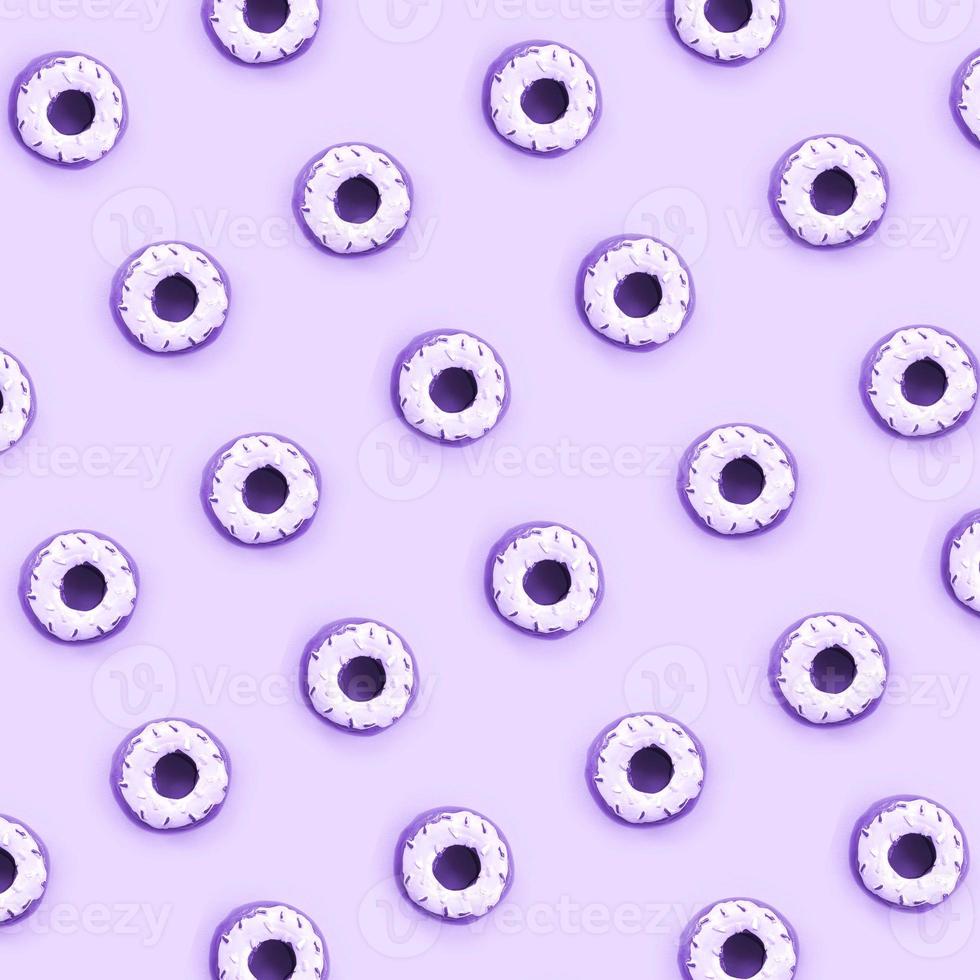 Many small plastic donuts lies on a pastel colorful background. Flat lay minimal pattern. Top view photo