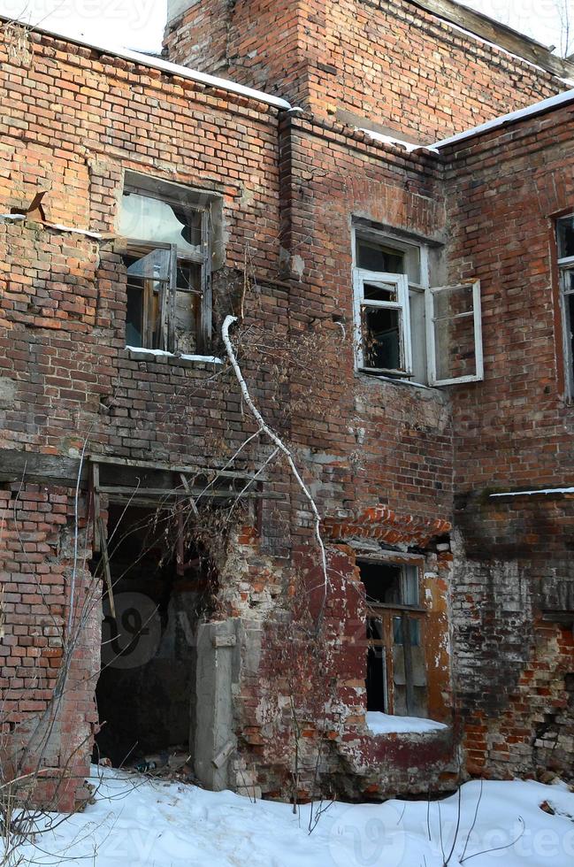 Fragment of an abandoned two-story building after military operations in Donetsk photo