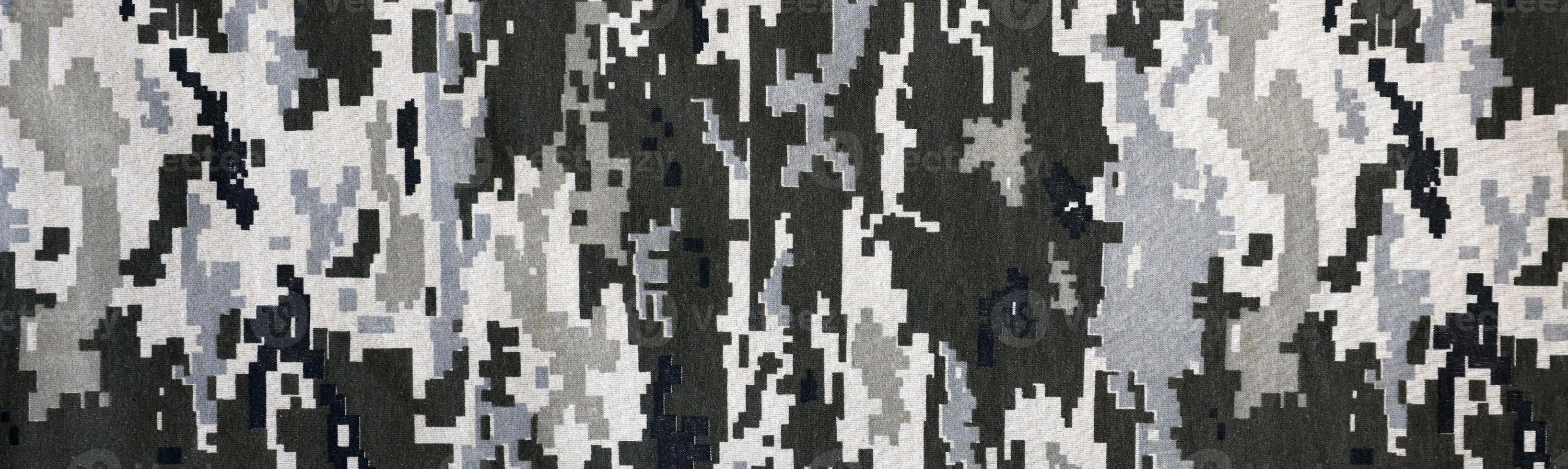 Fabric with texture of Ukrainian military pixeled camouflage. Cloth with camo pattern in grey, brown and green pixel shapes. Official uniform of Ukrainian soldiers photo