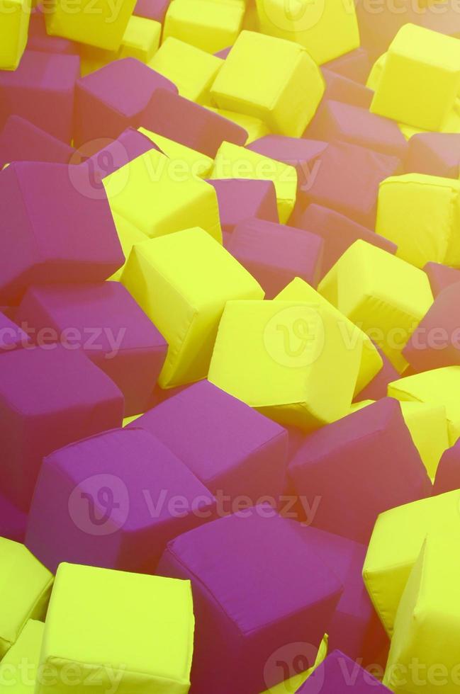 Many colorful soft blocks in a kids' ballpit at a playground photo