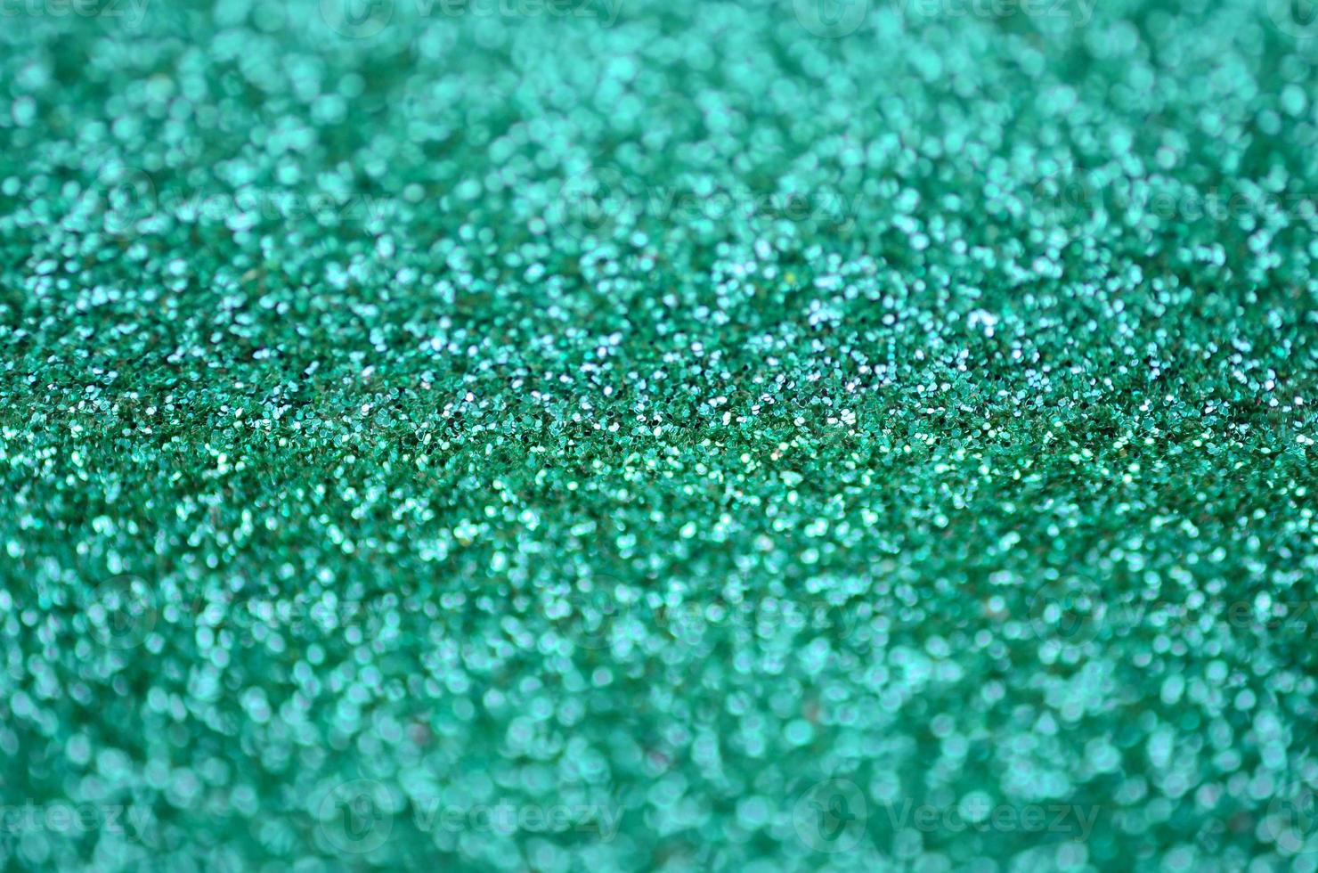 A huge amount of decorative sequins. Background image with shiny bokeh lights from small elements photo