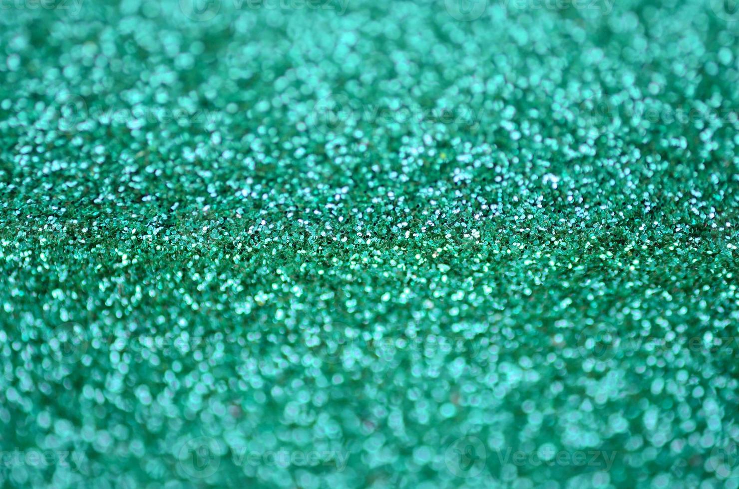 A huge amount of decorative sequins. Background image with shiny bokeh lights from small elements photo