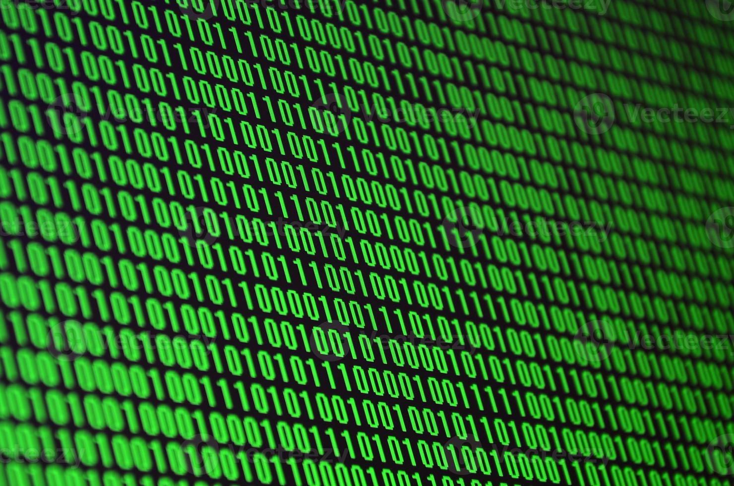 An image of a binary code made up of a set of green digits on a black background photo