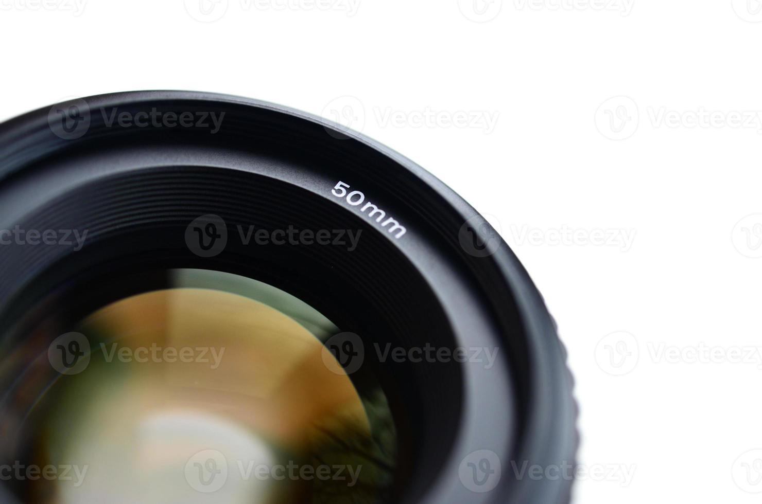 Fragment of a portrait lens for a modern SLR camera. A photograph of a wide-aperture lens with a focal length of 50mm isolated on white photo