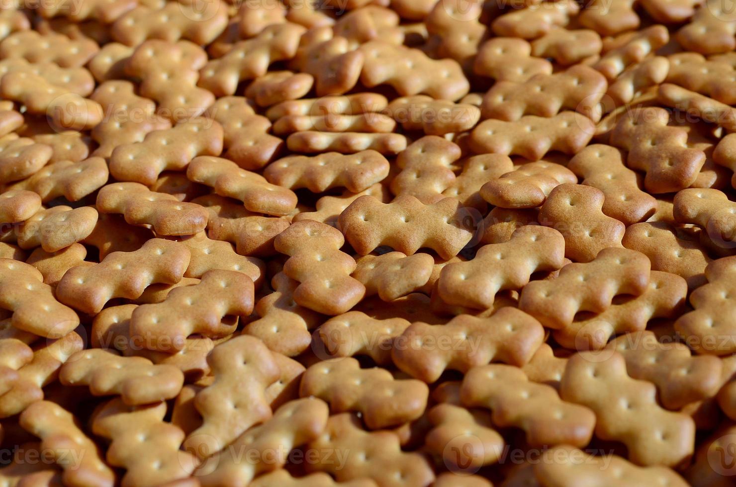 Pattern of a many yellow salted crackers photo