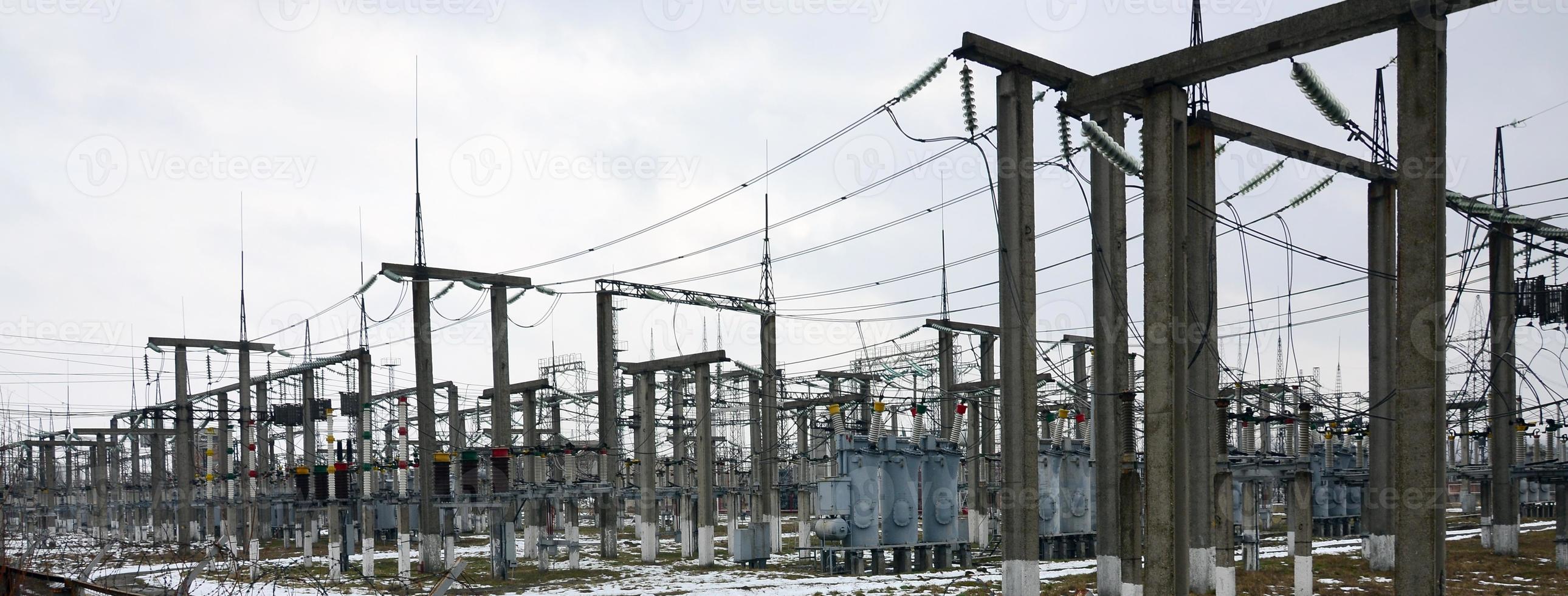 Power plant is a station of transformation. A lot of cables, poles and wires, transformers. Electro-energy. photo