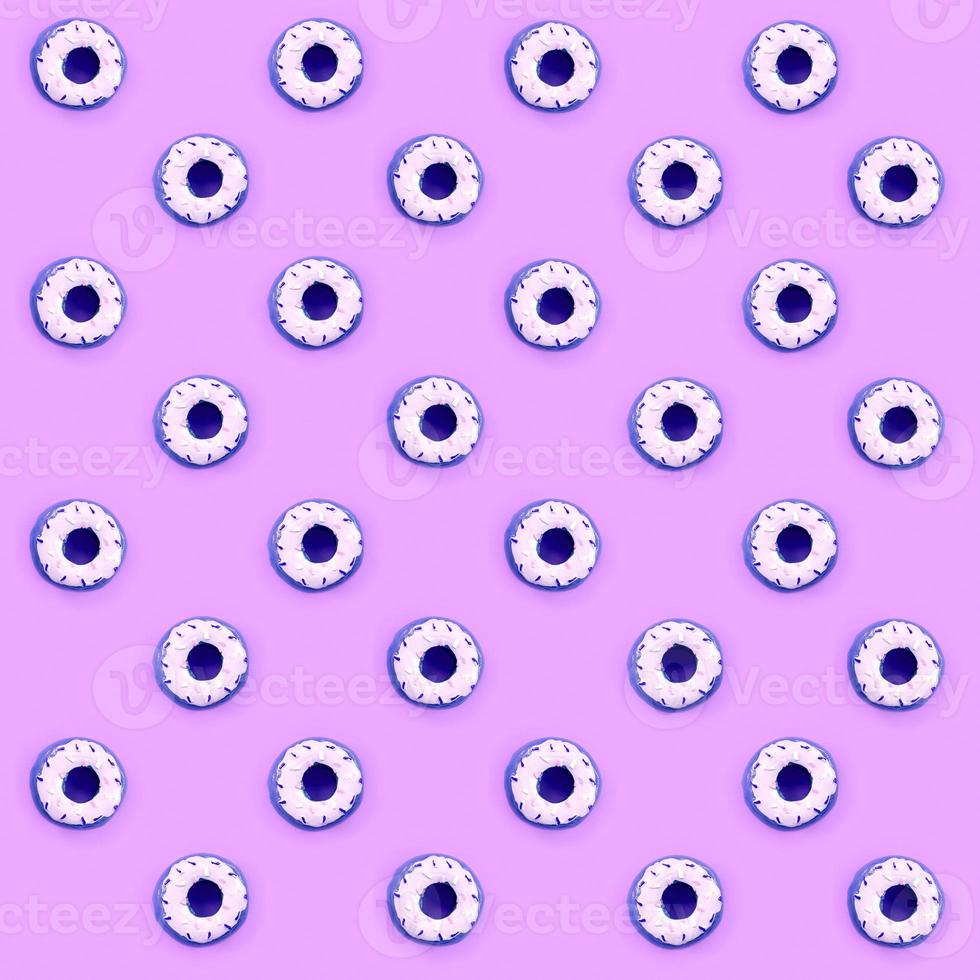 Many small plastic donuts lies on a pastel colorful background. Flat lay minimal pattern. Top view photo