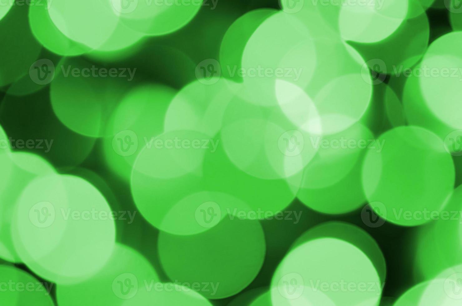 Green abstract Christmas blurred luminous background. Defocused artistic bokeh lights image photo