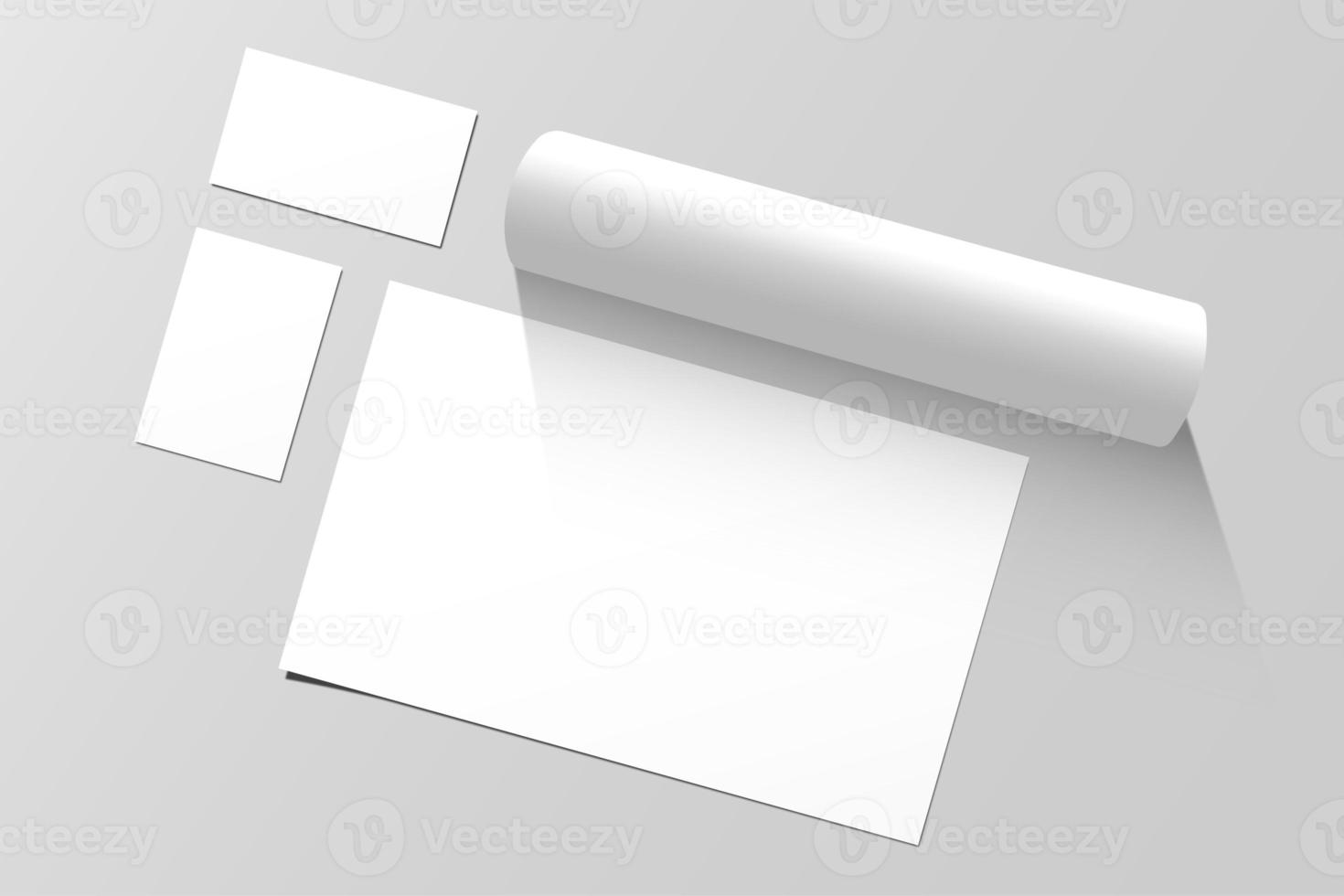 Business card mockup design and blank paper with white tube isolated on gray background photo