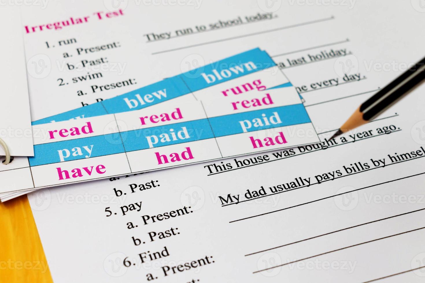 english exam on table with pencil photo