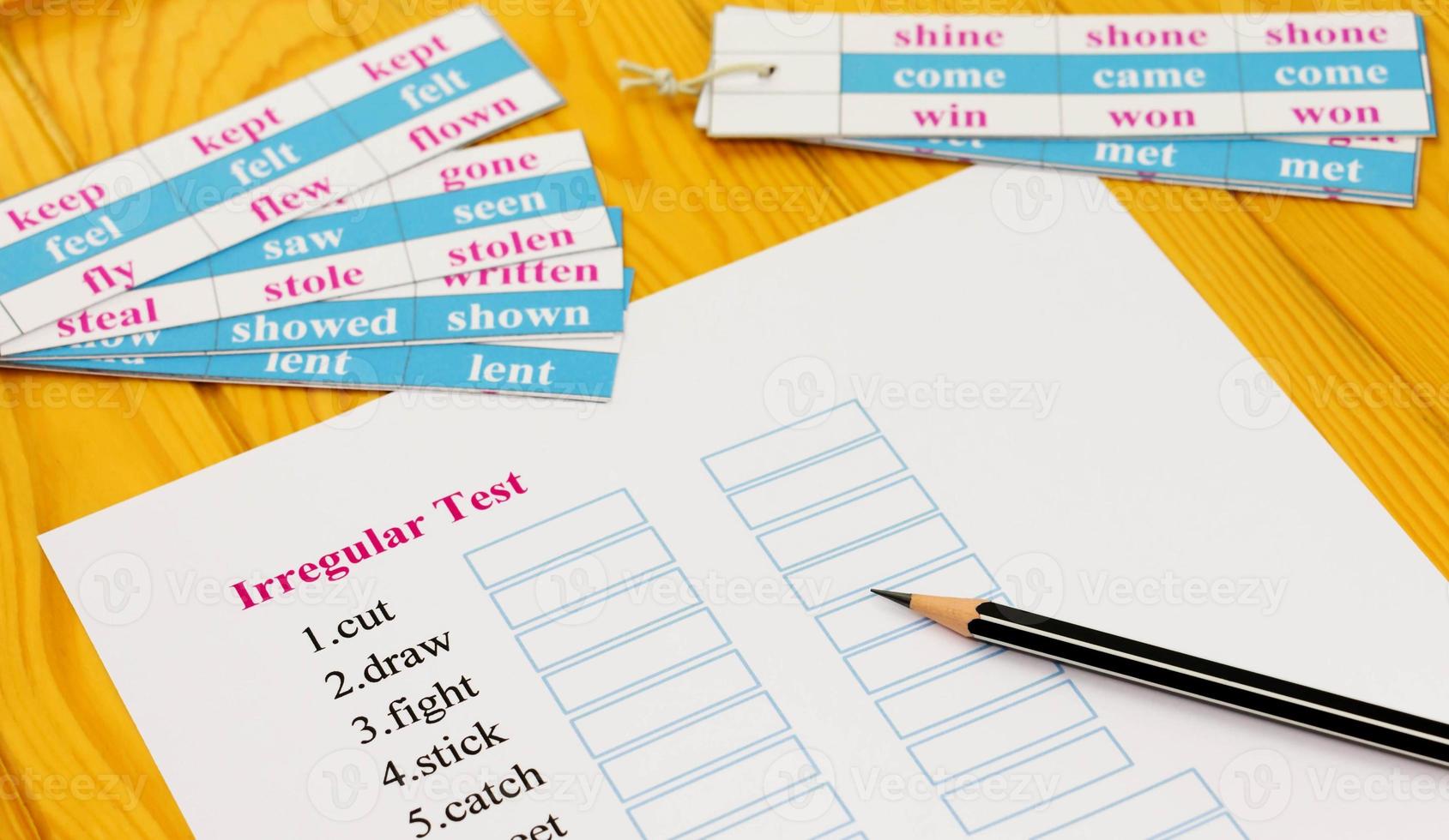 english exam on table with pencil photo