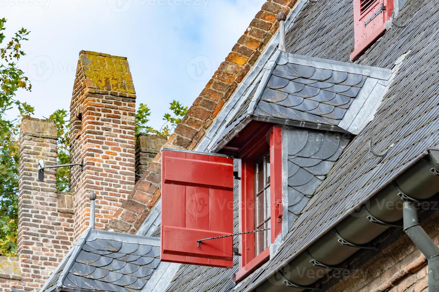 old building roof with windows photo