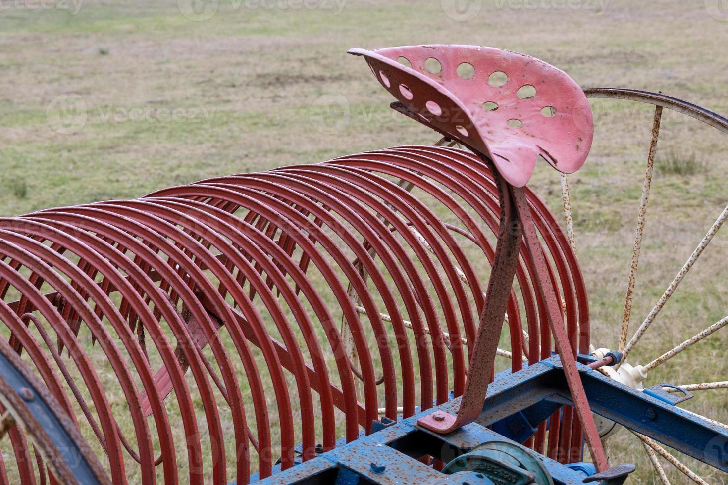 part of a tractor on a field photo