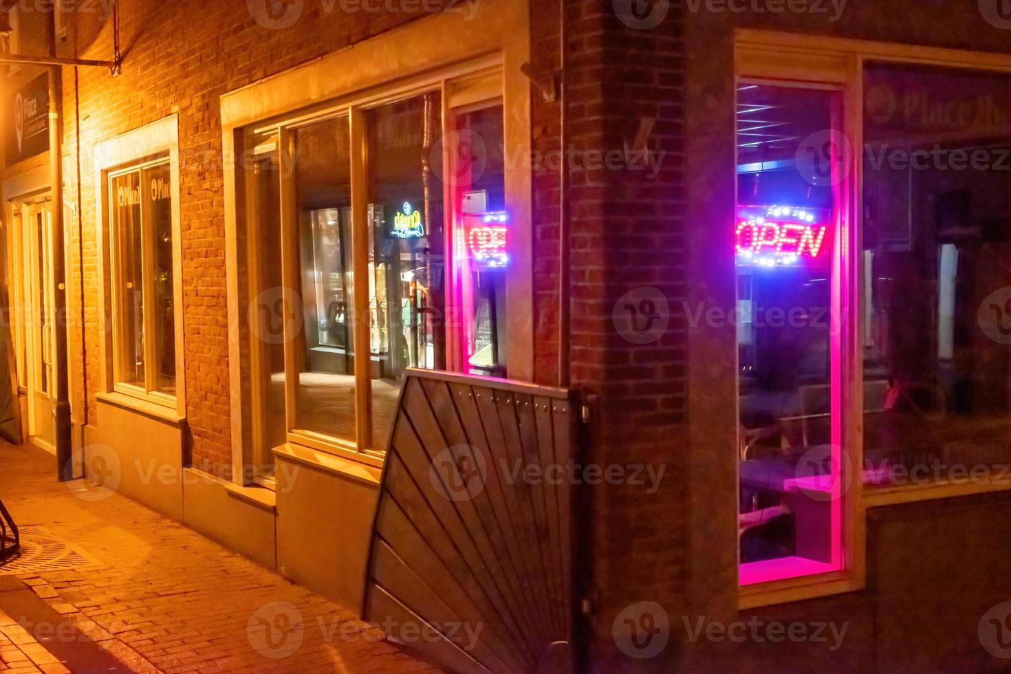 entrance to the house in the night with lamps photo