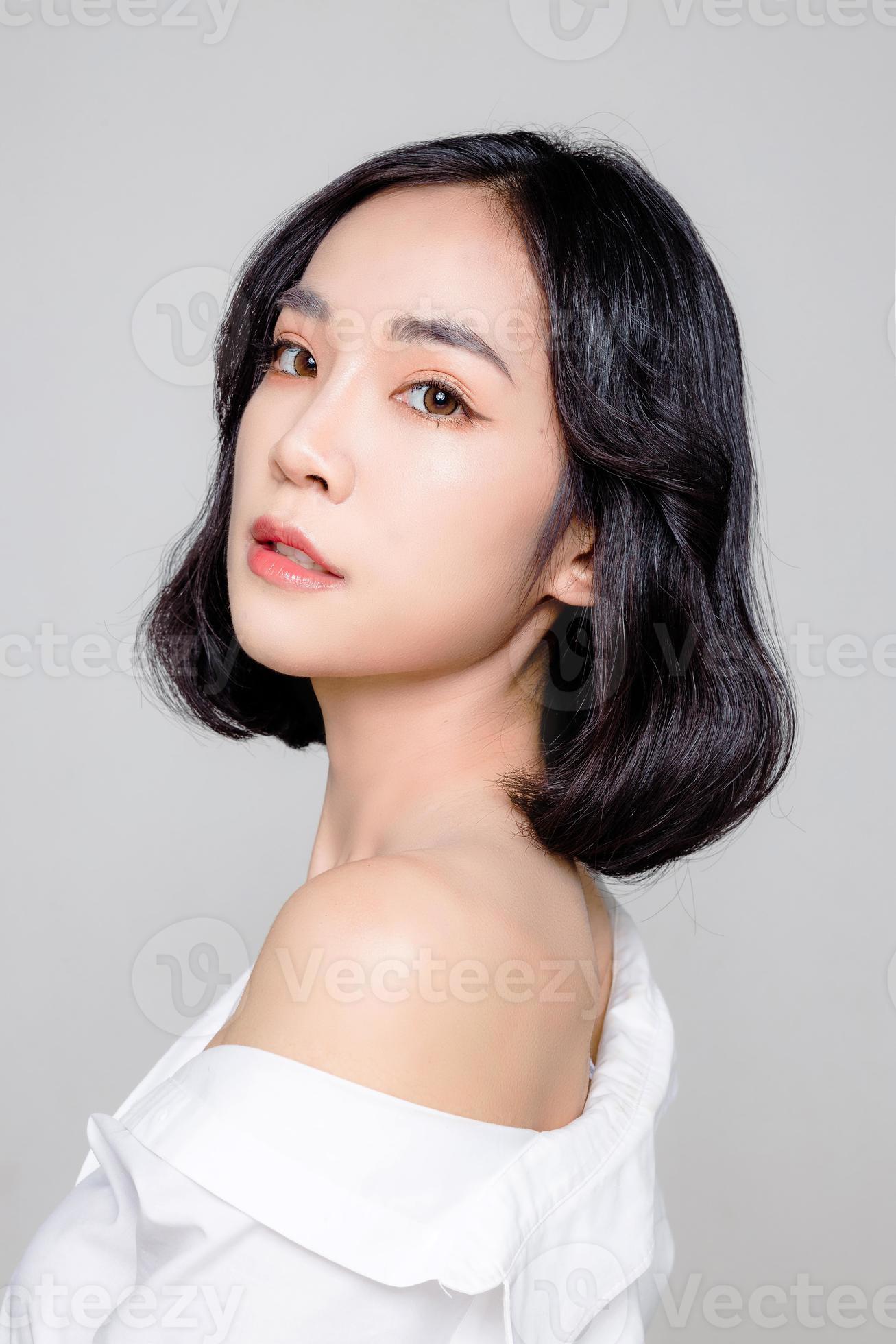 Asian woman short hair with Perfect clean fresh skin. Cute female model  with natural makeup and sparkling eyes on white isolated background. Facial  treatment, Cosmetology, beauty Concept. 12311291 Stock Photo at Vecteezy