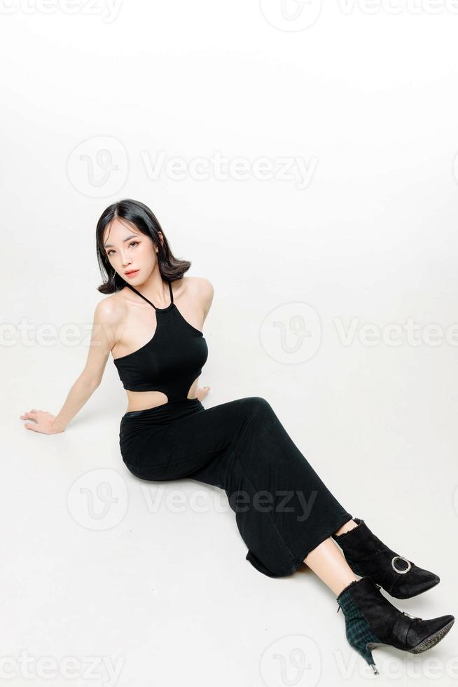 Fashionable asian woman short hair with Perfect body. Cute female model with natural makeup and sparkling eyes on white isolated background. Facial treatment, Cosmetology, beauty Concept. photo