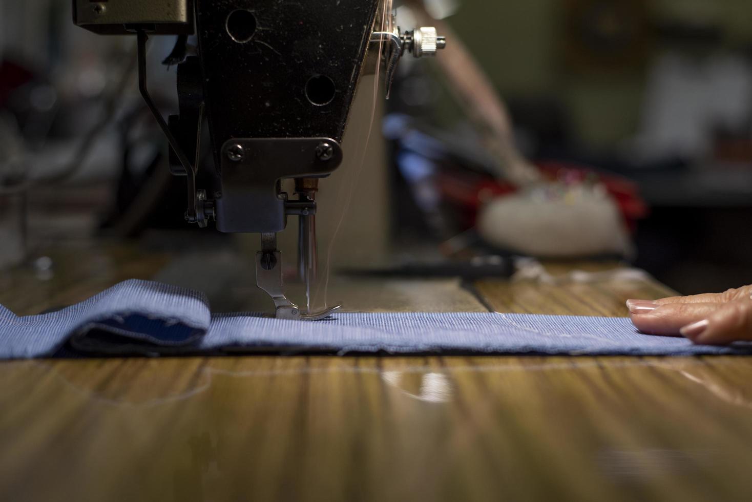 The motion of sewing machine needle bar in selective focus. photo