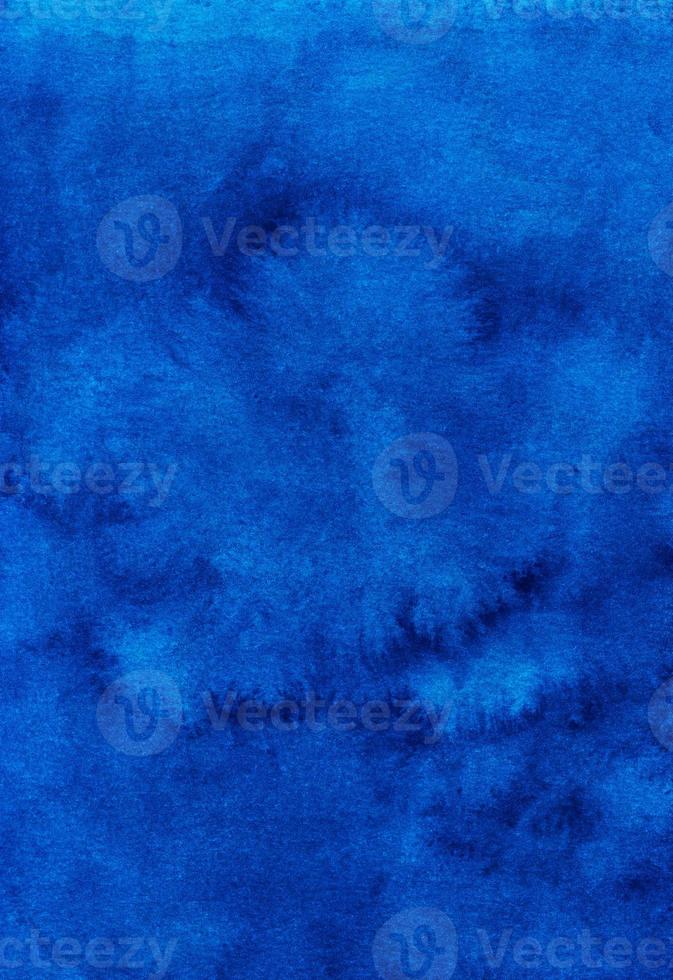 Watercolor deep ocean blue background texture. Aquarelle abstract royal blue backdrop. Stains on paper, hand painted photo