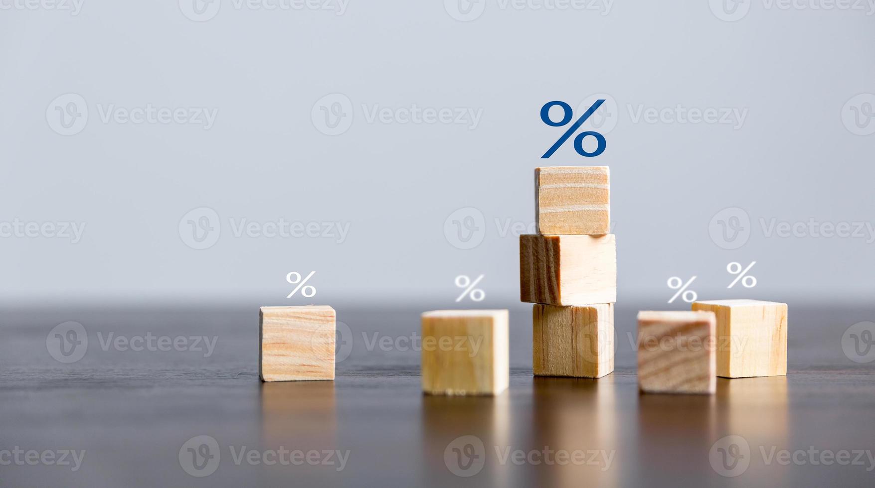 Closeup wood cubes with percentage symbol, business interest, discount investment, financial growth, interest rate increase, sale price and tax rise, future gain, market digital concept photo