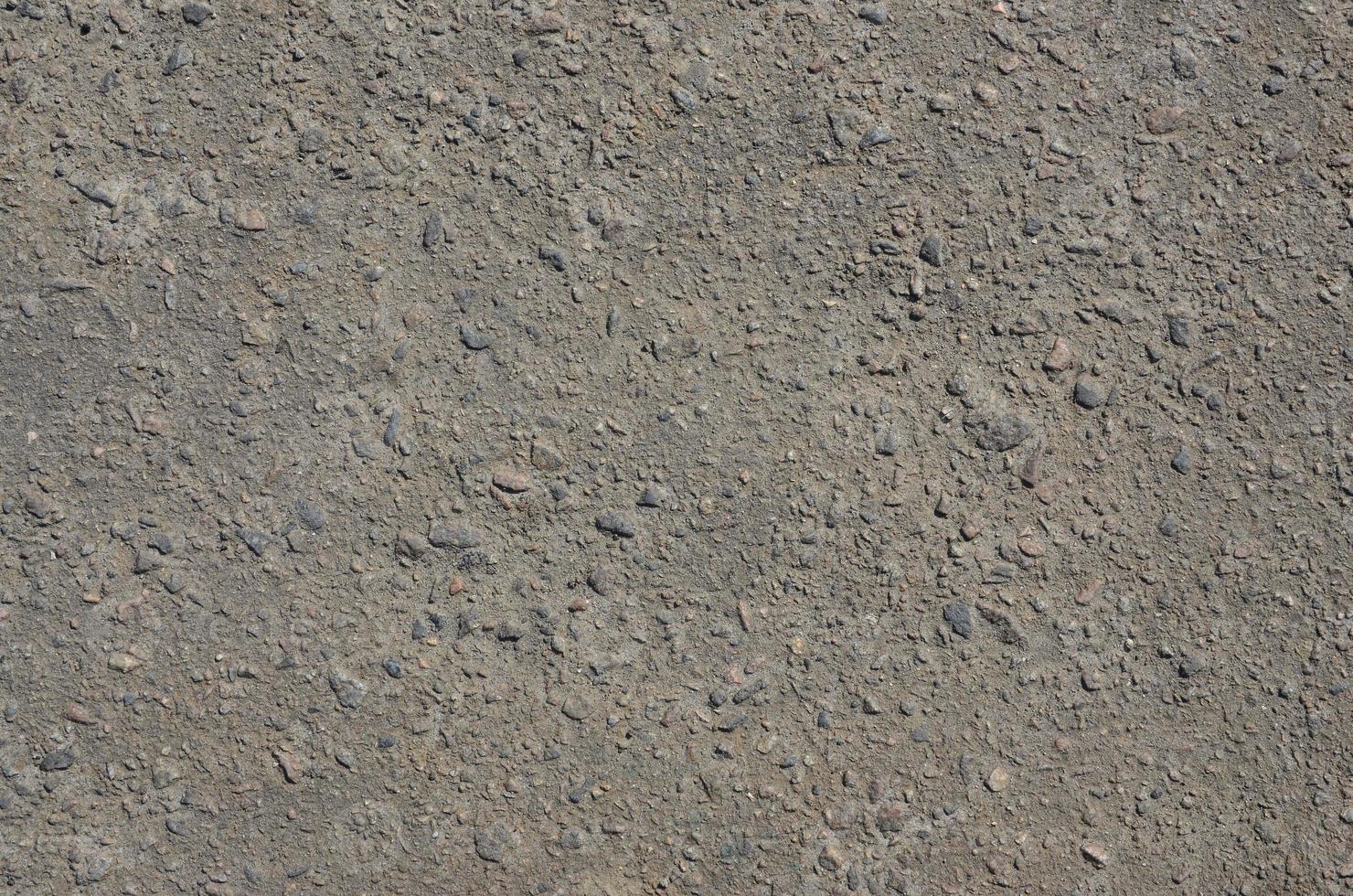 Texture of dirty and gloomy gray asphalt photo