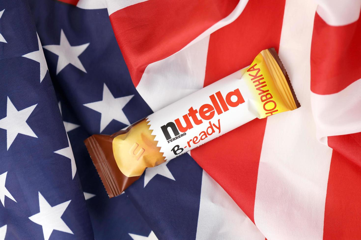 KHARKIV, UKRAINE - DECEMBER 16, 2021 Bar of Nutella B-ready crunchy wafer shell filled with creamy Nutella and sprinkled with puffed crisps photo