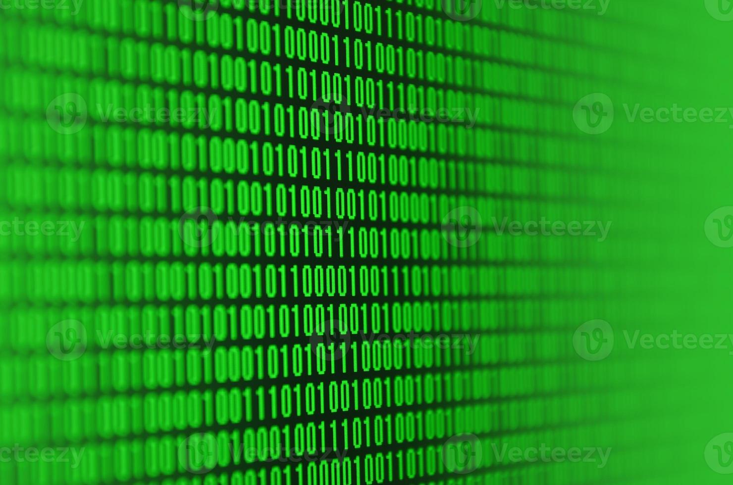 An image of a binary code made up of a set of green digits on a black background photo