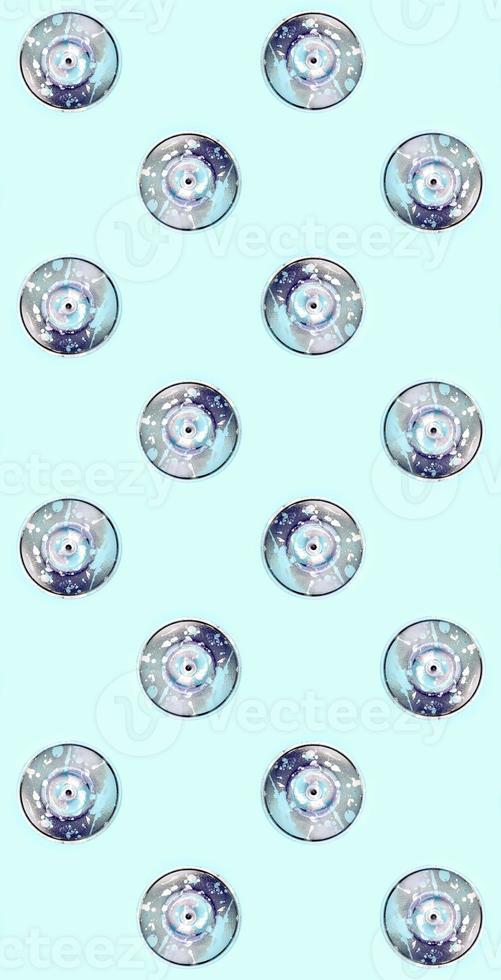 Many used spray cans for graffiti drawing lies on a pastel colored backgroung. Street art painting concept. Minimal flat lay pattern. Top view photo