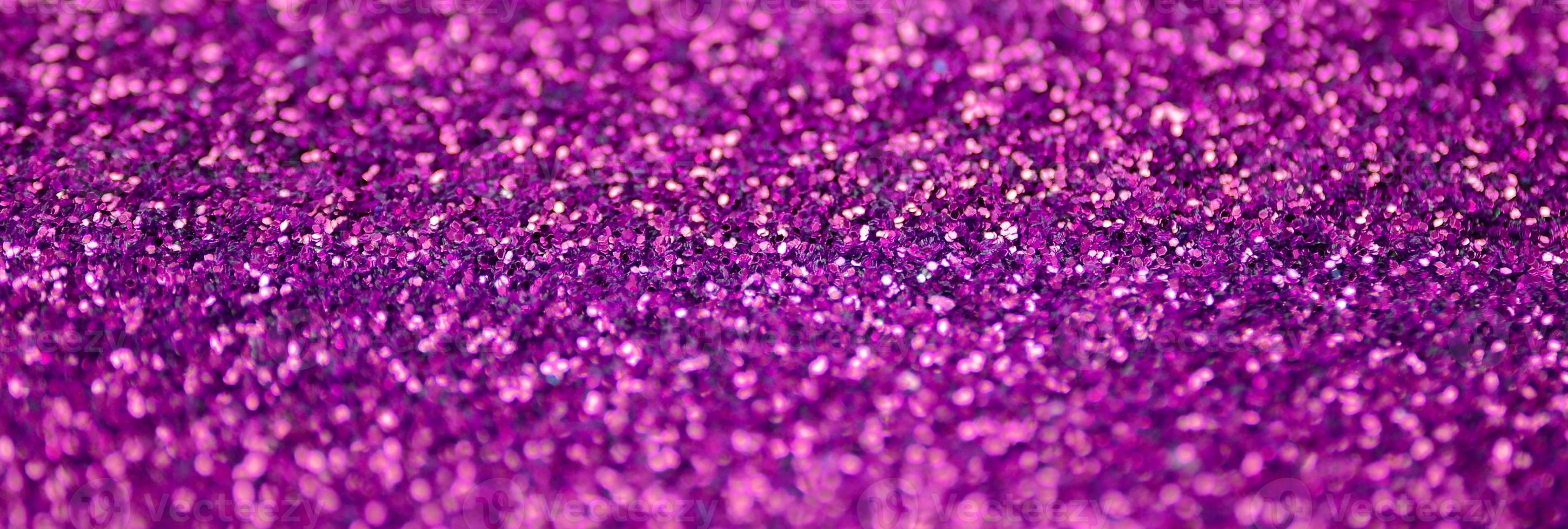 Pink decorative sequins. Background image with shiny bokeh lights from small elements photo