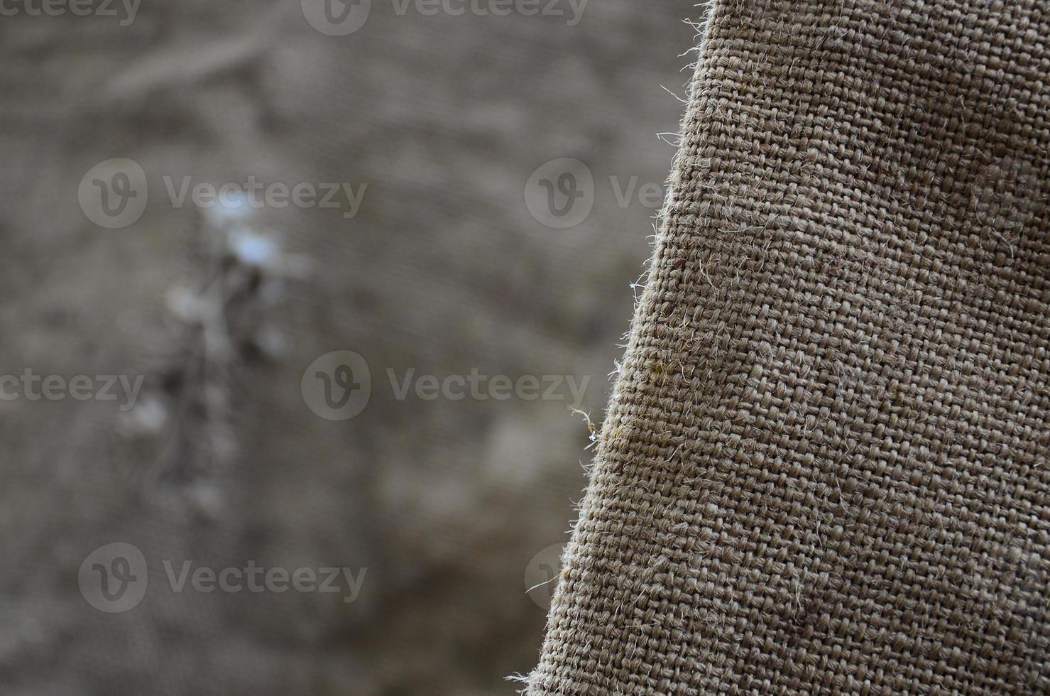 The texture of a very old brown sack cloth. Retro texture with canvas material. Background image with copy space photo