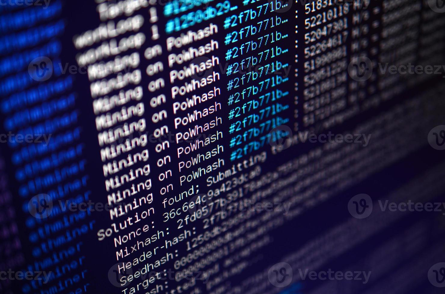 Macro snapshot of the program interface for crypto currency mining on the monitor of an office computer. The concept of mining bitcoins. The flow of information strings and data photo