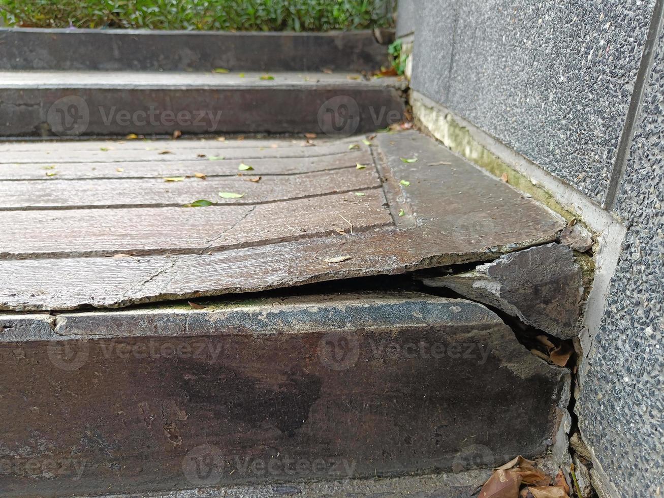 The stairway was built with cracked cement. photo