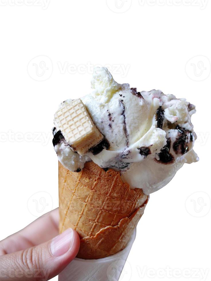 Cutout of a left hand holding blueberry cheesecake ice cream in waffle cone, isolated, object, transparent, copy space with clipping path photo