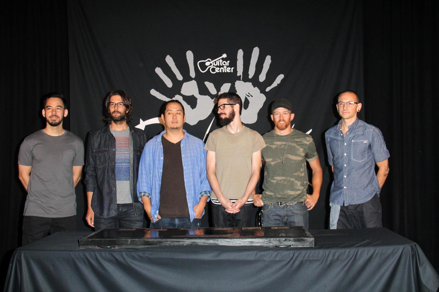 LOS ANGELES, JUN 18 -  Linkin Park, Mike Shinoda, Rob Bourdon, Joe Hahn, Brad Delson, Dave Farrell, Chester Bennington at the Linkin Park Rockwalk Inducting Ceremony at the Guitar Center on June 18, 2014 in Los Angeles, CA photo