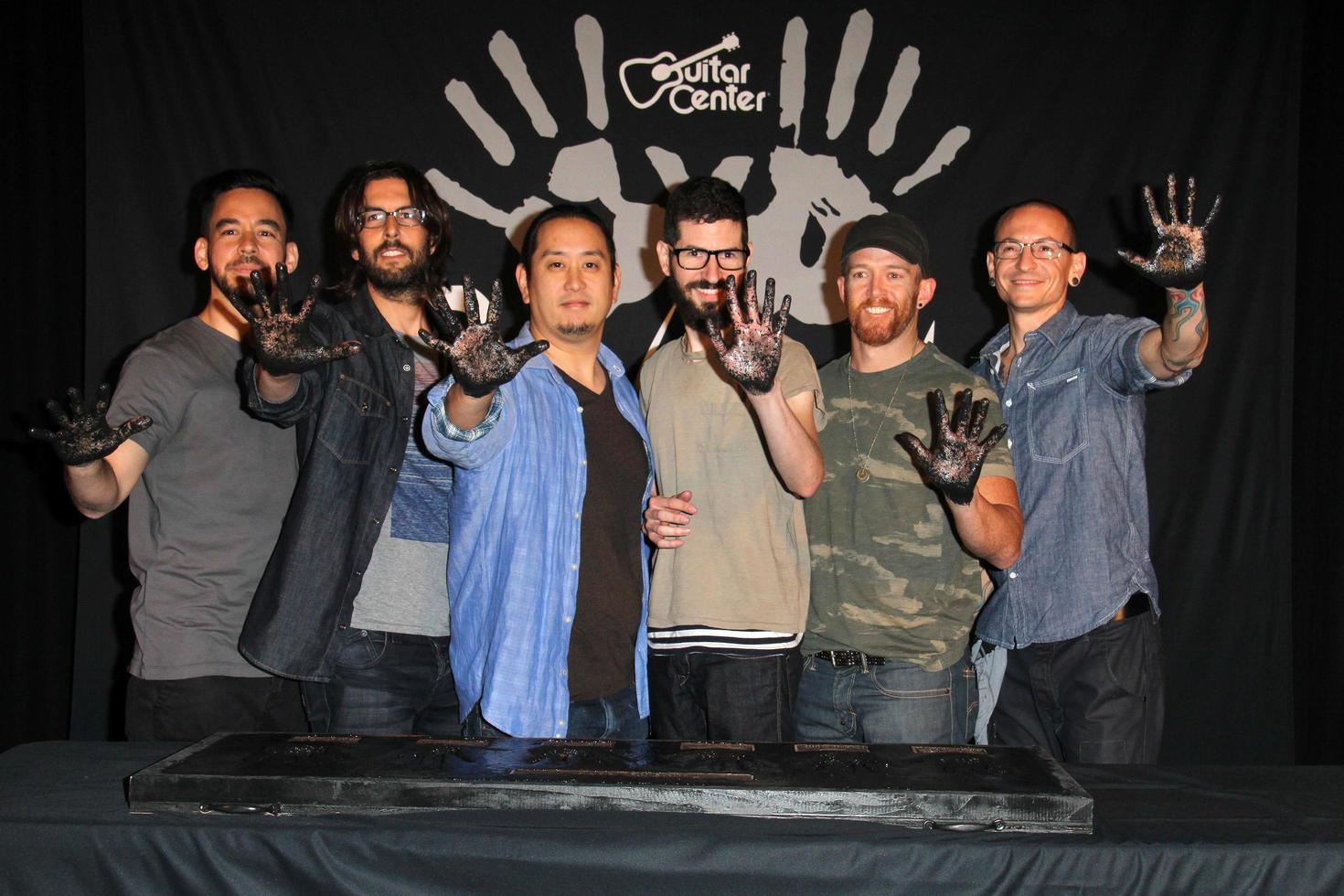 LOS ANGELES, JUN 18 -  Linkin Park, Mike Shinoda, Rob Bourdon, Joe Hahn, Brad Delson, Dave Farrell, Chester Bennington at the Linkin Park Rockwalk Inducting Ceremony at the Guitar Center on June 18, 2014 in Los Angeles, CA photo