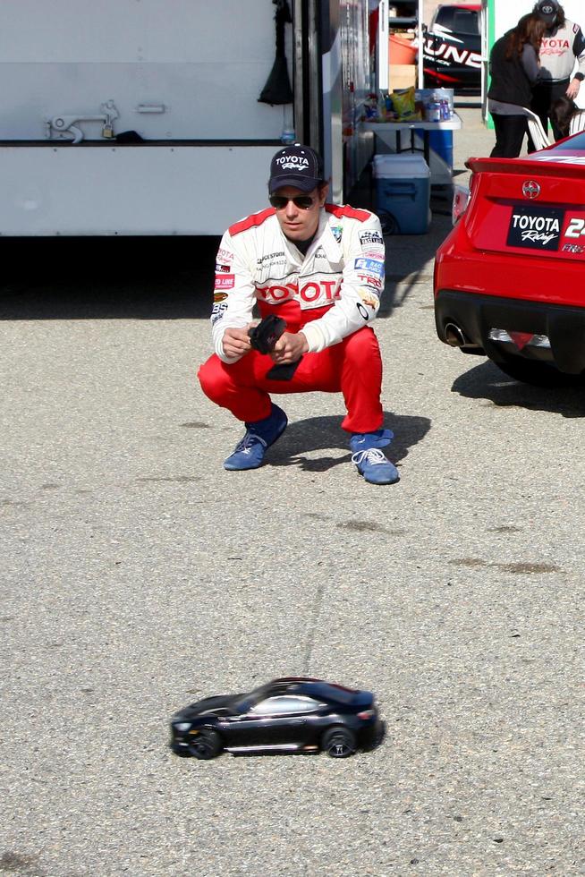 LOS ANGELES, MAR 23 - Michael Trucco playing with a remote control car at the 37th Annual Toyota Pro Celebrity Race training at the Willow Springs International Speedway on March 23, 2013 in Rosamond, CA     EXCLUSIVE PHOTO