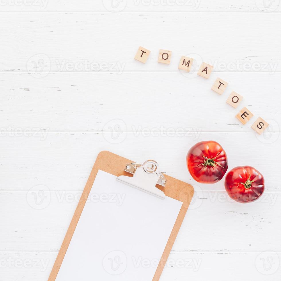 Tomatoes Mar Azul on white wooden table background photo