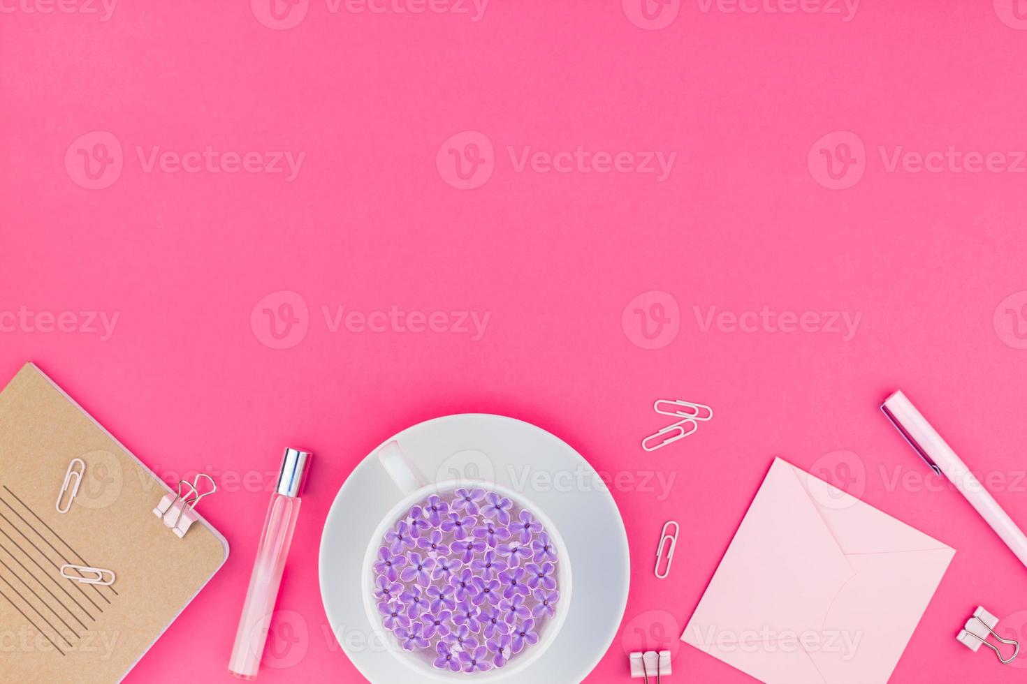 Styled pink feminine workspace flat lay photo