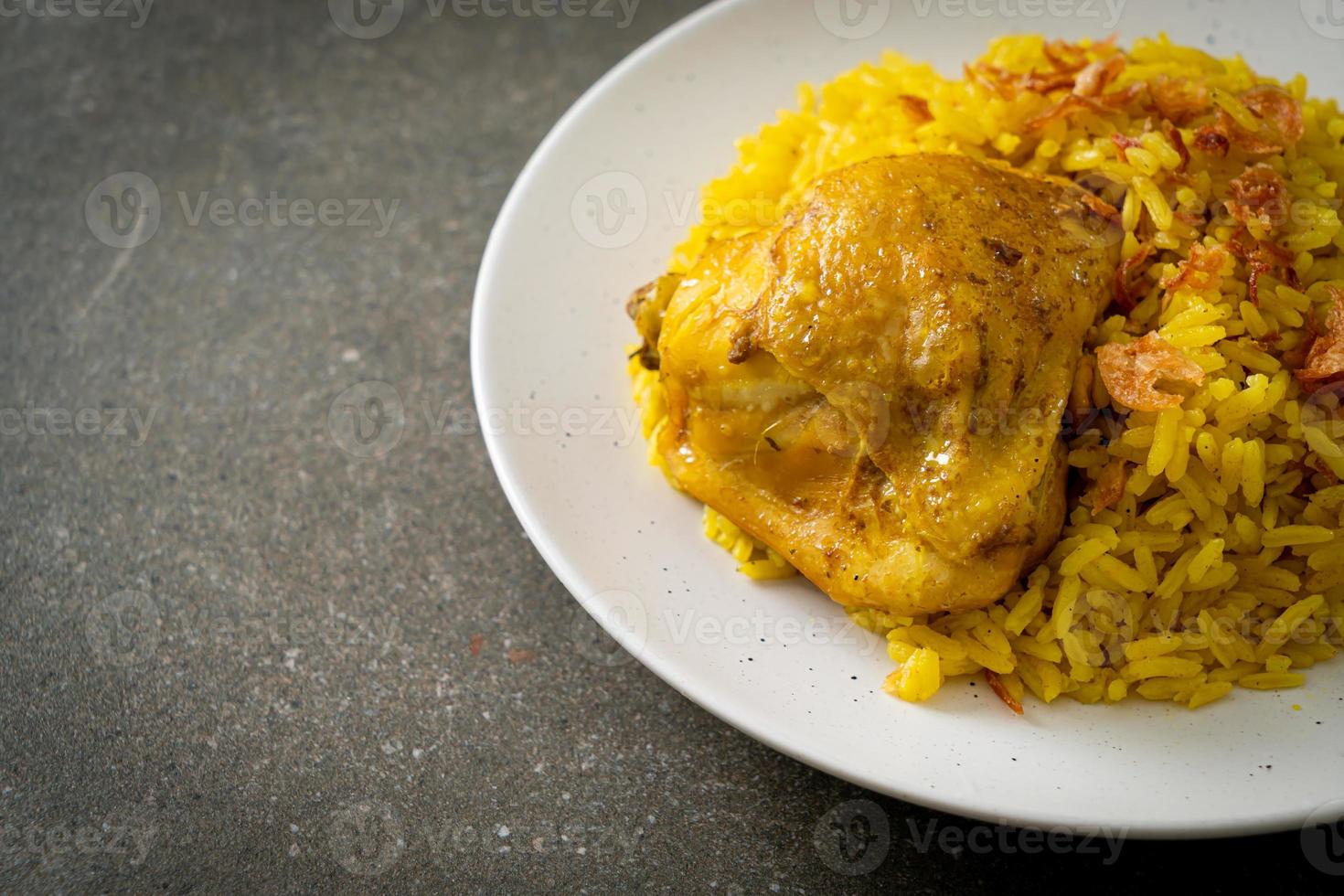 Chicken Biryani or Curried rice and chicken - Thai-Muslim version of Indian biryani, with fragrant yellow rice and chicken photo