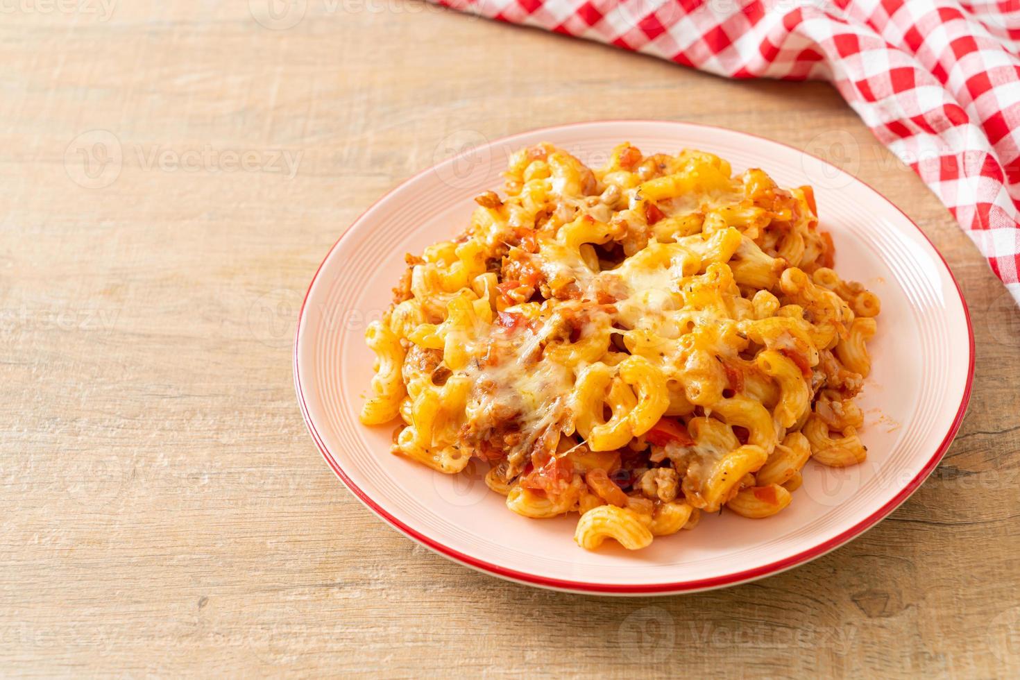 homemade macaroni bolognese with cheese photo