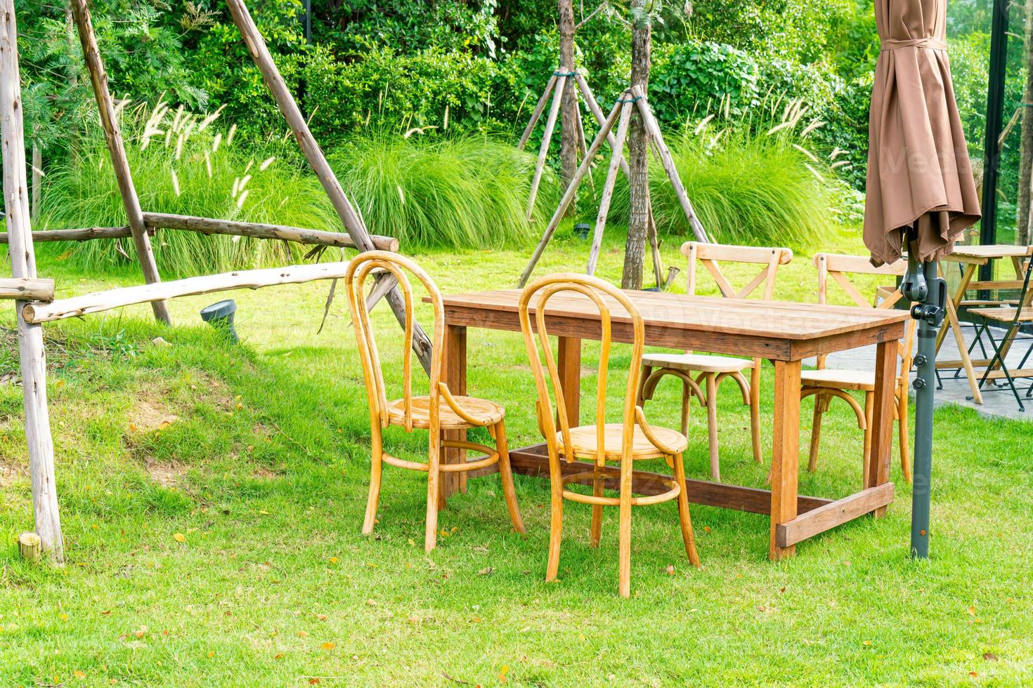 wood table and chair in garden photo